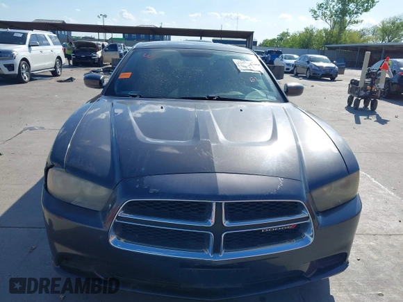 2013 Dodge Charger SE z VIN 2C3CDXBG5DH571669, wystawiony jako IAAI lot #42093056 z przebiegiem 181 157 mil mil oraz . Historia ofert i sprzedaży dostępna na DreamBid. Obrazek 12.