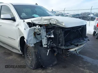 2015 Chevrolet Suburban LT with VIN 1GNSKJKC0FR309866, listed as a IAAI auction lot 41743848 with 220,778 mi miles and . Bid and sale history available at DreamBid. Image 6.
