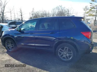 2023 Honda Passport EX-L with VIN 5FNYF8H51PB028045, listed as a IAAI auction lot 41609342 with 52,920 mi miles and . Bid and sale history available at DreamBid. Image 15.