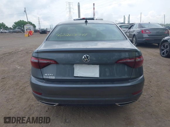 2021 Volkswagen Jetta SEL Premium z VIN 3VWG57BU8MM017203, wystawiony jako IAAI lot #42263741 z przebiegiem 26 556 mil mil oraz . Historia ofert i sprzedaży dostępna na DreamBid. Obrazek 16.