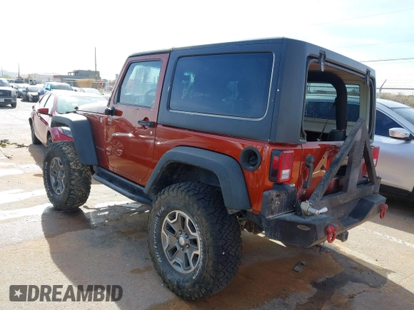 2014 Jeep Wrangler Rubicon with VIN 1C4BJWCG8EL185597, listed as a IAAI auction lot 41914489 with 85,545 mi miles and . Bid and sale history available at DreamBid. Image 3.