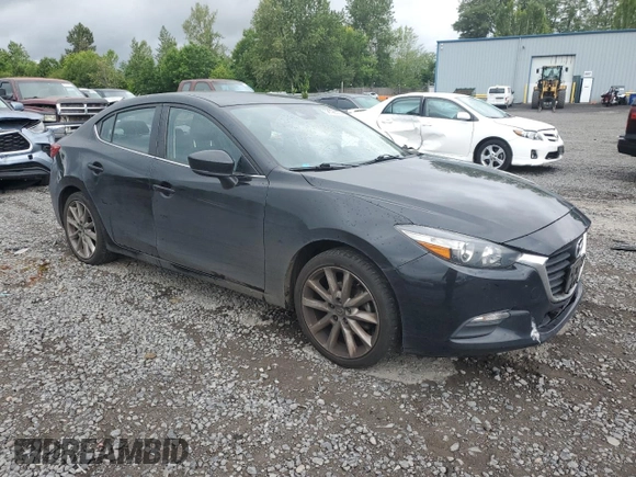 2017 Mazda 3 Touring with VIN JM1BN1V7XH1143503, listed as a Copart auction lot 58628085 with 181,345 mi miles and Salvage title. Bid and sale history available at DreamBid. Image 4.