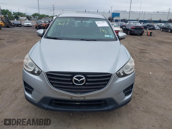 2016 Mazda CX-5 Sport z VIN JM3KE4BY1G0711602, wystawiony jako IAAI lot #42537627 z przebiegiem Nie podano mil oraz . Historia ofert i sprzedaży dostępna na DreamBid. Obrazek 12.