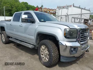 2015 GMC Sierra 2500HD SLT with VIN 1GT12ZE85FF590798, listed as a IAAI auction lot 42265357 with 185,061 mi miles and . Bid and sale history available at DreamBid. Image 1.