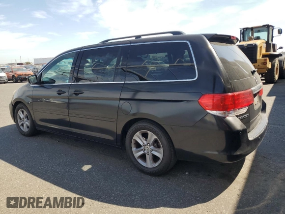 2010 Honda Odyssey Touring with VIN 5FNRL3H9XAB067890, listed as a Copart auction lot 63520575 with 213,582 mi miles and Clean title. Bid and sale history available at DreamBid. Image 2.
