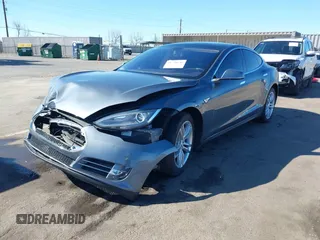 2014 Tesla Model S 60 with VIN 5YJSA1S10EFP32851, listed as a IAAI auction lot 41730746 with 91,657 mi miles and . Bid and sale history available at DreamBid. Image 2.