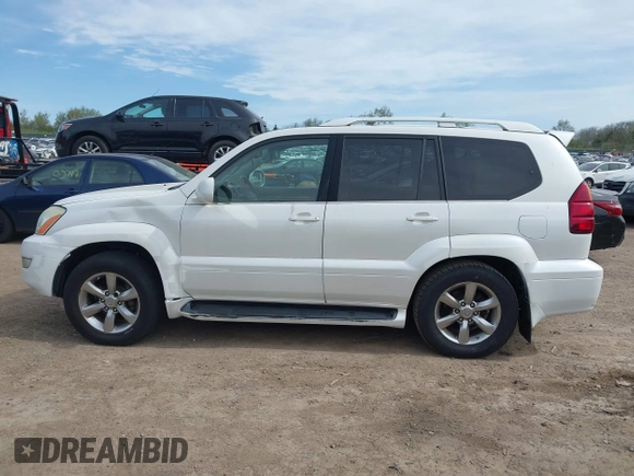 2004 Lexus GX 470 with VIN JTJBT20X440062559, listed as a IAAI auction lot 42142442 with 261,126 mi miles. Bid and sale history available at carsss.com. Image 14.