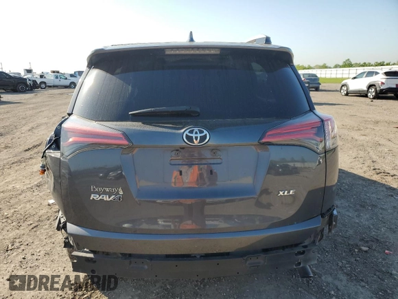 2018 Toyota RAV4 XLE with VIN 2T3WFREV0JW517488, listed as a Copart auction lot 51000975 with 68,105 mi miles and Salvage title. Bid and sale history available at DreamBid. Image 6.