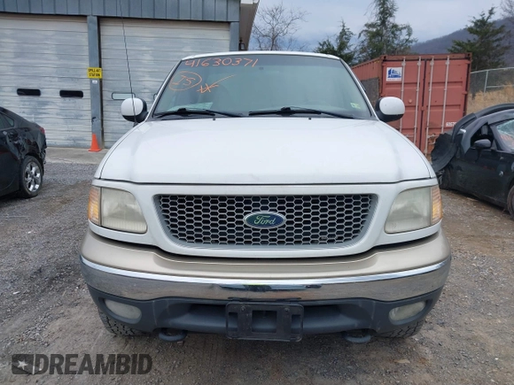 1999 Ford F-150 XL with VIN 1FTRX18LXXKA75357, listed as a IAAI auction lot 41630371 with 202,021 mi miles. Bid and sale history available at carsss.com. Image 13.