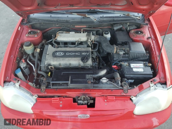 2001 Kia Sephia z VIN KNAFB121715066725, wystawiony jako Copart lot #86552964 z przebiegiem 76 915 mil mil oraz Tytuł czysty. Historia ofert i sprzedaży dostępna na DreamBid. Obrazek 11.