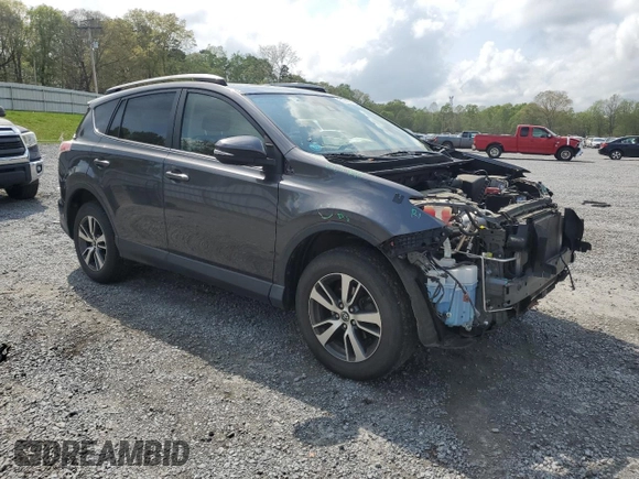 2018 Toyota RAV4 XLE with VIN JTMRFREV2JJ215776, listed as a Copart auction lot 51745205 with 52,009 mi miles and Salvage Title. Bid and sale history available at DreamBid. Image 4.