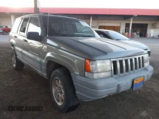 1998 Jeep Grand Cherokee Laredo with VIN 1J4GZ58S9WC136684, listed as a IAAI auction lot 41444103 with 1 mi miles. Bid and sale history available at carsss.com. Image 1.