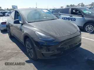 2024 Tesla Model Y with VIN 7SAYGDED5RF126518, listed as a IAAI auction lot 42611784 with 6,311 mi miles and . Bid and sale history available at DreamBid. Image 1.