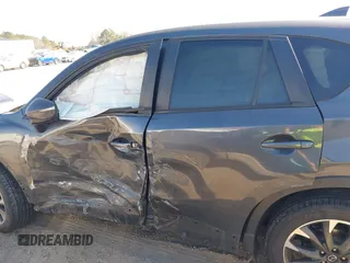 2016 Mazda CX-5 Grand Touring with VIN JM3KE4DY8G0823567, listed as a IAAI auction lot 41784384 with 143,836 mi miles and . Bid and sale history available at carsss.com. Image 14.