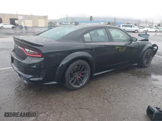 2021 Dodge Charger Scat Pack Widebody with VIN 2C3CDXGJ9MH561070, listed as a IAAI auction lot 41798863 with 62,984 mi miles. Bid and sale history available at carsss.com. Image 4.