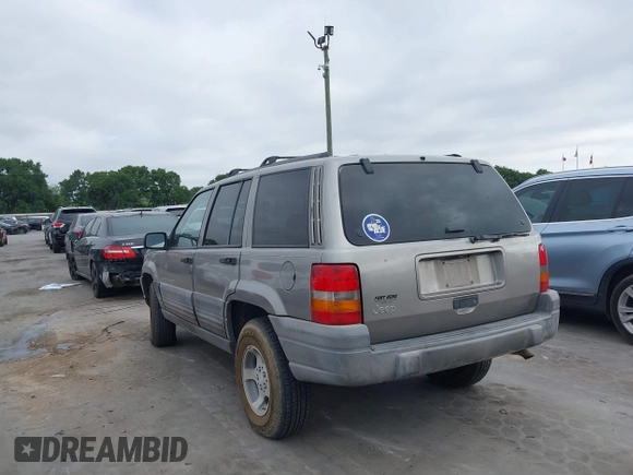 1998 Jeep Grand Cherokee Laredo with VIN 1J4FX58S6WC354101, listed as a IAAI auction lot 42158671 with 289,318 mi miles and . Bid and sale history available at DreamBid. Image 3.