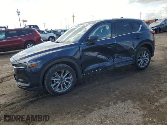 2021 Mazda CX-5 Grand Touring with VIN JM3KFBDM0M0500561, listed as a Copart auction lot 58214665 with 49,543 mi miles and Salvage title. Bid and sale history available at DreamBid. Image 1.