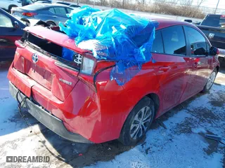 2020 Toyota Prius L Eco with VIN JTDKARFU7L3122166, listed as a IAAI auction lot 41346319 with 116,961 mi miles. Bid and sale history available at carsss.com. Image 4.