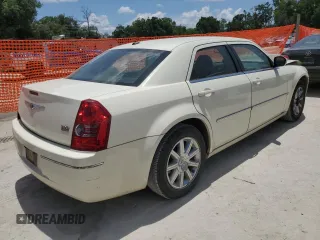 2009 Chrysler 300 Touring z VIN 2C3KA53V09H594340, wystawiony jako Copart lot #57789525 z przebiegiem 166 216 mil mil oraz Szkoda całkowita • Salvage title. Historia ofert i sprzedaży dostępna na DreamBid. Obrazek 3.