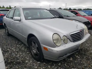 2001 Mercedes-Benz E-Class AWD with VIN WDBJF83J01X047817, listed as a Copart auction lot 71675084 with 143,127 mi miles and Salvage Title. Bid and sale history available at carsss.com. Image 4.