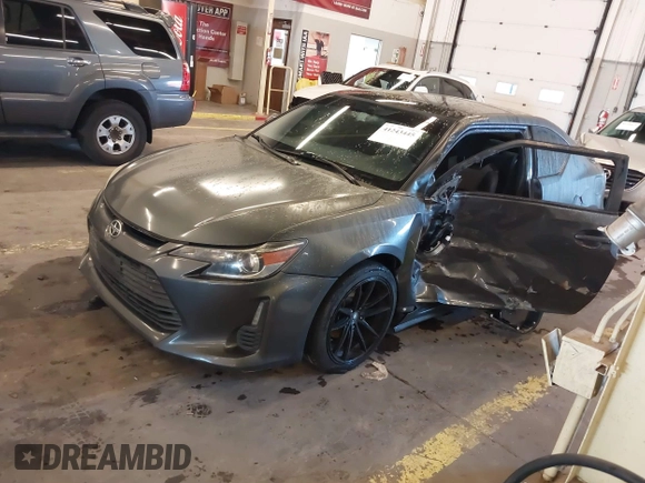 2014 Scion tC with VIN JTKJF5C77E3069906, listed as a IAAI auction lot 41243445 with 128,791 mi miles. Bid and sale history available at carsss.com. Image 17.