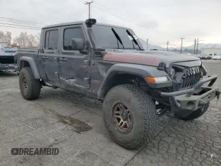 2021 Jeep Gladiator Rubicon with VIN 1C6JJTBG9ML512347, listed as a Copart auction lot 43197415 with 134,608 mi miles and Salvage title. Bid and sale history available at DreamBid. Image 4.
