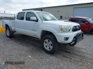 2013 Toyota Tacoma PreRunner with VIN 5TFKU4HN6DX003129, listed as a IAAI auction lot 42190939 with 206,404 mi miles and . Bid and sale history available at DreamBid. Image 1.