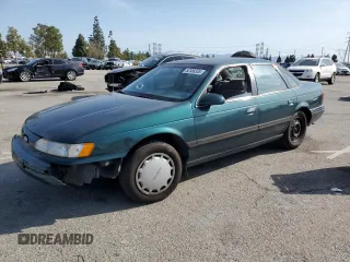 1995 Ford Taurus GL with VIN 1FALP52U0SG154035, listed as a Copart auction lot 52308335 with 99,532 mi miles and Salvage title. Bid and sale history available at DreamBid. Image 1.