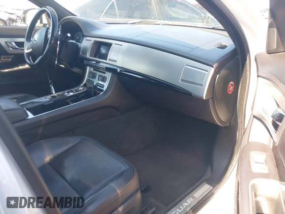 2015 Jaguar XF V6 Portfolio with VIN SAJWJ0FF9F8U48932, listed as a IAAI auction lot 41696899 with 203,110 mi miles. Bid and sale history available at carsss.com. Image 5.