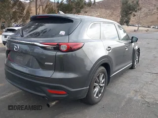 2018 Mazda CX-9 Sport with VIN JM3TCABY1J0224741, listed as a IAAI auction lot 41265876 with 126,686 mi miles and . Bid and sale history available at DreamBid. Image 4.