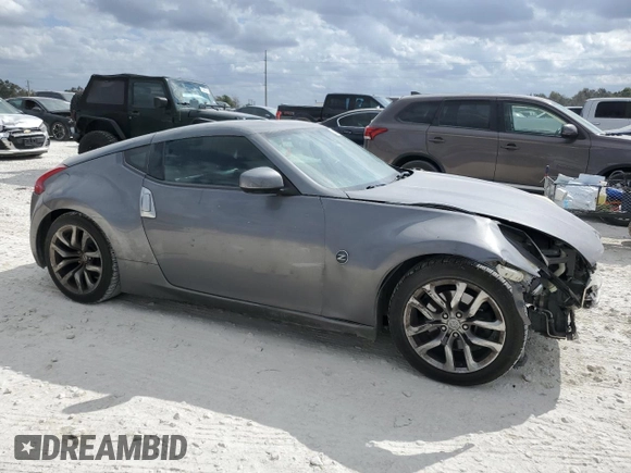 2013 Nissan 370Z with VIN JN1AZ4EH7DM880230, listed as a Copart auction lot 78398894 with 130,871 mi miles and Salvage Title. Bid and sale history available at carsss.com. Image 4.