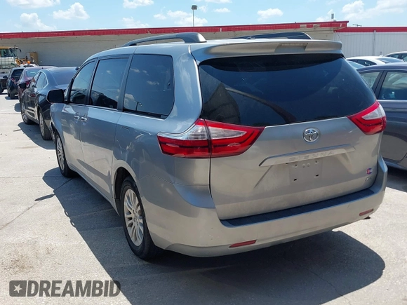 2015 Toyota Sienna XLE with VIN 5TDYK3DC0FS555636, listed as a IAAI auction lot 42099577 with 114,975 mi miles. Bid and sale history available at carsss.com. Image 3.