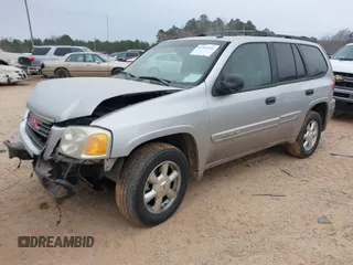 2005 GMC Envoy SLT with VIN 1GKDT13S452263166, listed as a IAAI auction lot 41543466 with 166,999 mi miles. Bid and sale history available at carsss.com. Image 2.