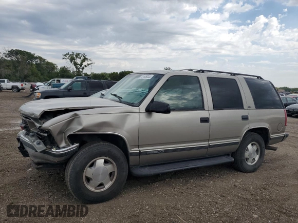 1999 GMC Yukon with VIN 1GKEK13R9XJ787877, listed as a Copart auction lot 72185044 with 191,710 mi miles and Salvage Title. Bid and sale history available at carsss.com. Image 1.