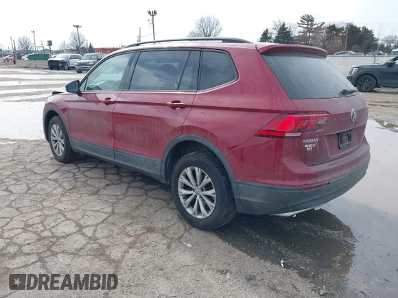 2018 Volkswagen Tiguan S with VIN 3VV1B7AX9JM085312, listed as a IAAI auction lot 41656827 with 122,322 mi miles and . Bid and sale history available at DreamBid. Image 3.