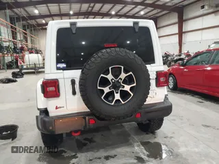 2021 Jeep Wrangler Unlimited Rubicon with VIN 1C4HJXFN2MW809904, listed as a IAAI auction lot 41567956 with 34,000 mi miles and . Bid and sale history available at DreamBid. Image 16.