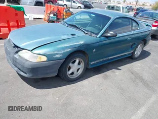 1997 Ford Mustang with VIN 1FALP4049VF200422, listed as a IAAI auction lot 42073947 with 157,937 mi miles. Bid and sale history available at carsss.com. Image 2.