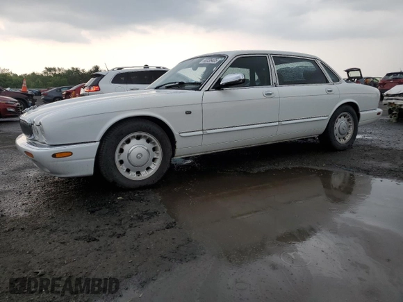 1999 Jaguar XJ with VIN SAJKD6041XC876928, listed as a Copart auction lot 60038405 with 63,917 mi miles and Clean title. Bid and sale history available at DreamBid. Image 1.