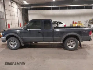2000 Ford Ranger XLT with VIN 1FTZR15X2YPB86720, listed as a IAAI auction lot 41501141 with 211,794 mi miles. Bid and sale history available at carsss.com. Image 14.