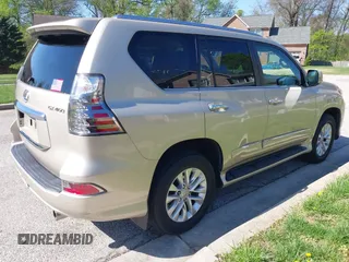 2014 Lexus GX with VIN JTJBM7FX7E5068037, listed as a IAAI auction lot 42069809 with 120,791 mi miles. Bid and sale history available at carsss.com. Image 4.