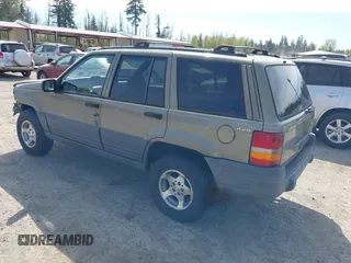 1997 Jeep Grand Cherokee Laredo with VIN 1J4GZ58S5VC500257, listed as a IAAI auction lot 41996034 with 222,513 mi miles and . Bid and sale history available at DreamBid. Image 3.