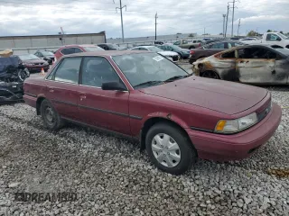 1991 Toyota Camry DLX z VIN 4T1SV21E0MU450578, wystawiony jako Copart lot #73990024 z przebiegiem 149 342 mil mil oraz Czysty tytuł • Clean title. Historia ofert i sprzedaży dostępna na DreamBid. Obrazek 4.