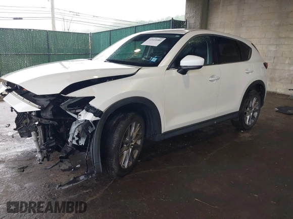 2019 Mazda CX-5 Grand Touring with VIN JM3KFBDMXK0648813, listed as a IAAI auction lot 42524680 with 23,521 mi miles and . Bid and sale history available at DreamBid. Image 18.