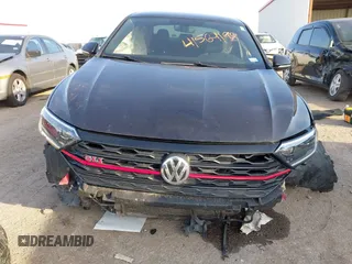 2019 Volkswagen Jetta GLI S z VIN 3VW5T7BU3KM245927, wystawiony jako IAAI lot #41573257 z przebiegiem 57 322 mil mil oraz . Historia ofert i sprzedaży dostępna na DreamBid. Obrazek 6.