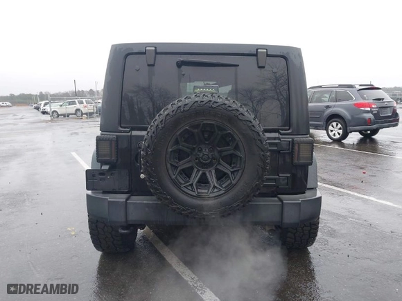 2017 Jeep Wrangler Unlimited Sport with VIN 1C4BJWDG8HL733956, listed as a IAAI auction lot 41792252 with 72,349 mi miles. Bid and sale history available at carsss.com. Image 16.