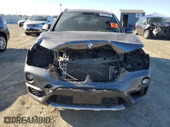 2017 BMW X1 sDrive28i with VIN WBXHU7C3XH5H36874, listed as a Copart auction lot 50607235 with 100,458 mi miles and Clean Title. Bid and sale history available at carsss.com. Image 5.