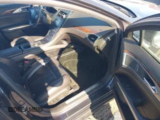 2014 Lincoln MKZ z VIN 3LN6L2J97ER835137, wystawiony jako IAAI lot #42062405 z przebiegiem 281 924 mil mil oraz . Historia ofert i sprzedaży dostępna na DreamBid. Obrazek 5.