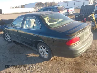 2001 Oldsmobile Intrigue GX z VIN 1G3WH52H11F127437, wystawiony jako IAAI lot #41446574 z przebiegiem Nie podano mil oraz . Historia ofert i sprzedaży dostępna na DreamBid. Obrazek 3.