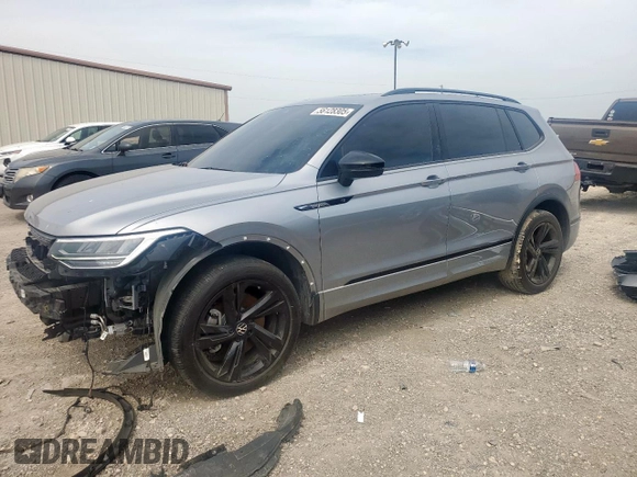 2023 Volkswagen Tiguan SE R-Line Black with VIN 3VVCB7AX5PM128335, listed as a Copart auction lot 56128305 with 21,524 mi miles and Salvage title. Bid and sale history available at DreamBid. Image 1.