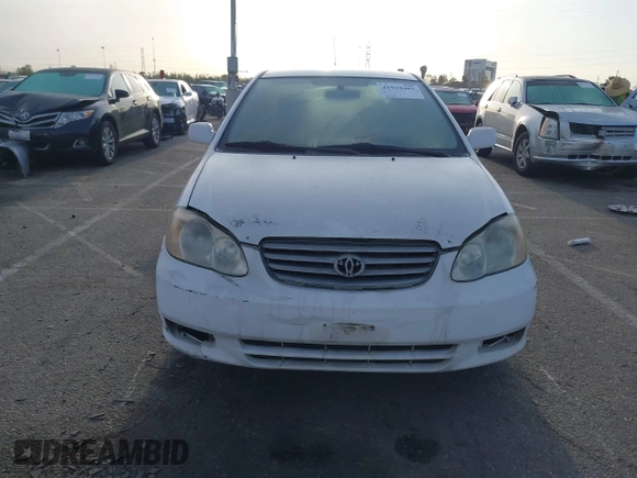 2004 Toyota Corolla CE with VIN JTDBR32E042025208, listed as a IAAI auction lot 41934485 with 299,999 mi miles. Bid and sale history available at carsss.com. Image 6.